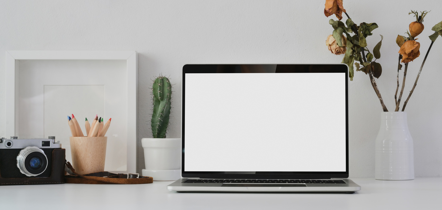 Macbook Pro on White Table